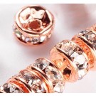 Kristallkivikestega messingist vahehelmes 4x2mm  värv roosa kuld, ava 1mm, pakis 10 tk.