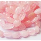 Розовый кварц 10-11х5-6мм натуральный камень, отверстие 0,8мм, в упаковке на веревочке около 36 штук.